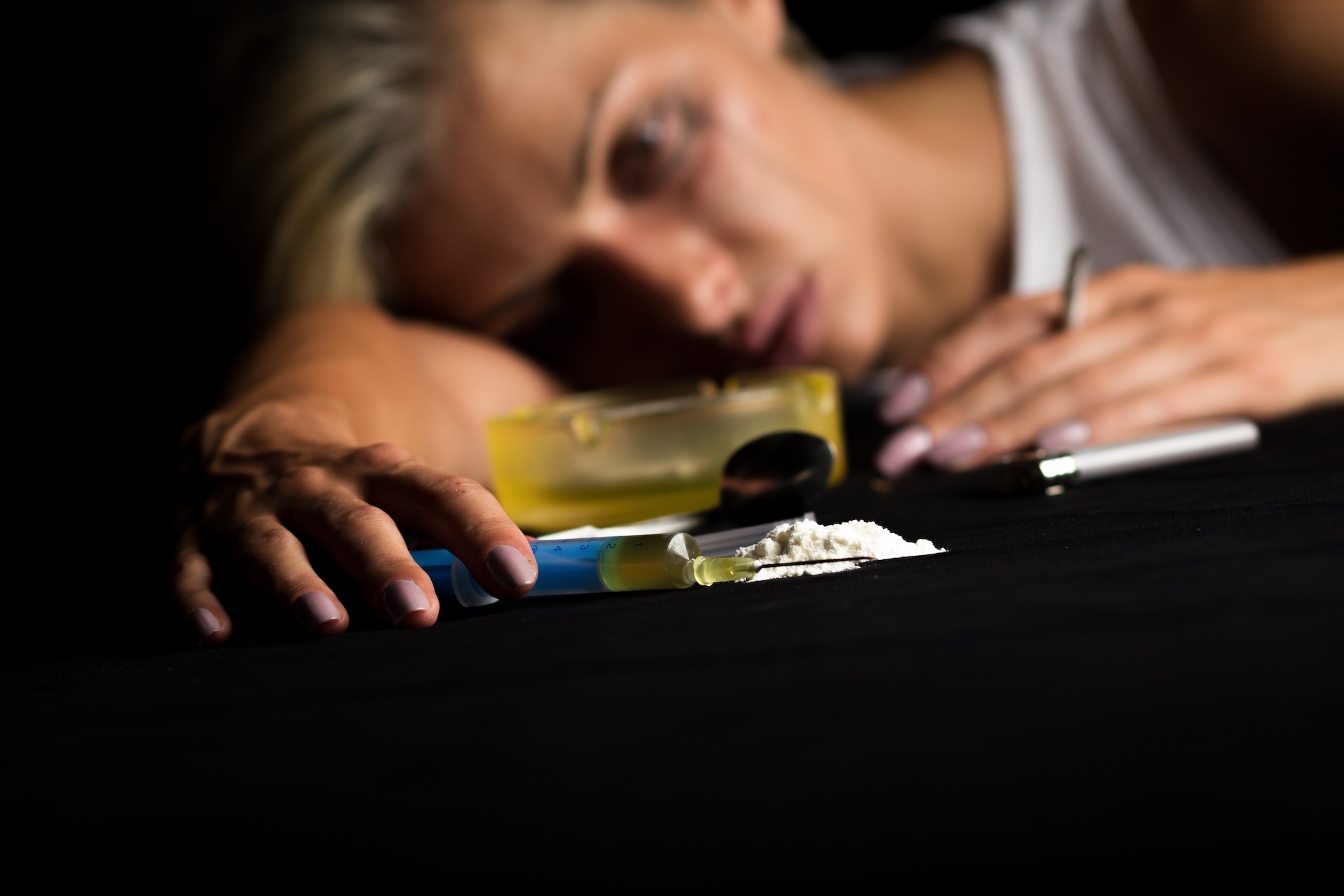 young-female-drug-addict-on-black-background-2025-01-30-05-38-53-utc