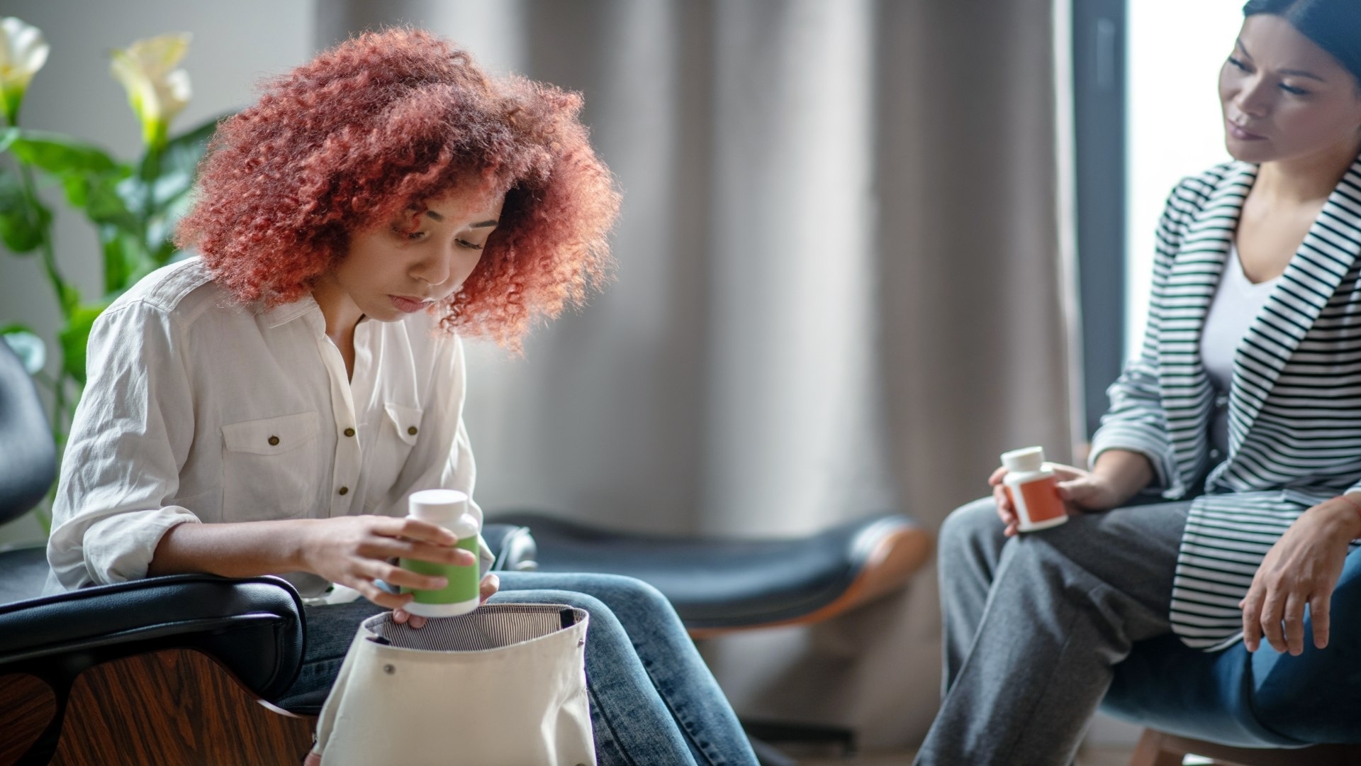 woman-putting-pills-into-bag-after-talking-to-psyc-2024-10-17-10-52-08-utc (1)