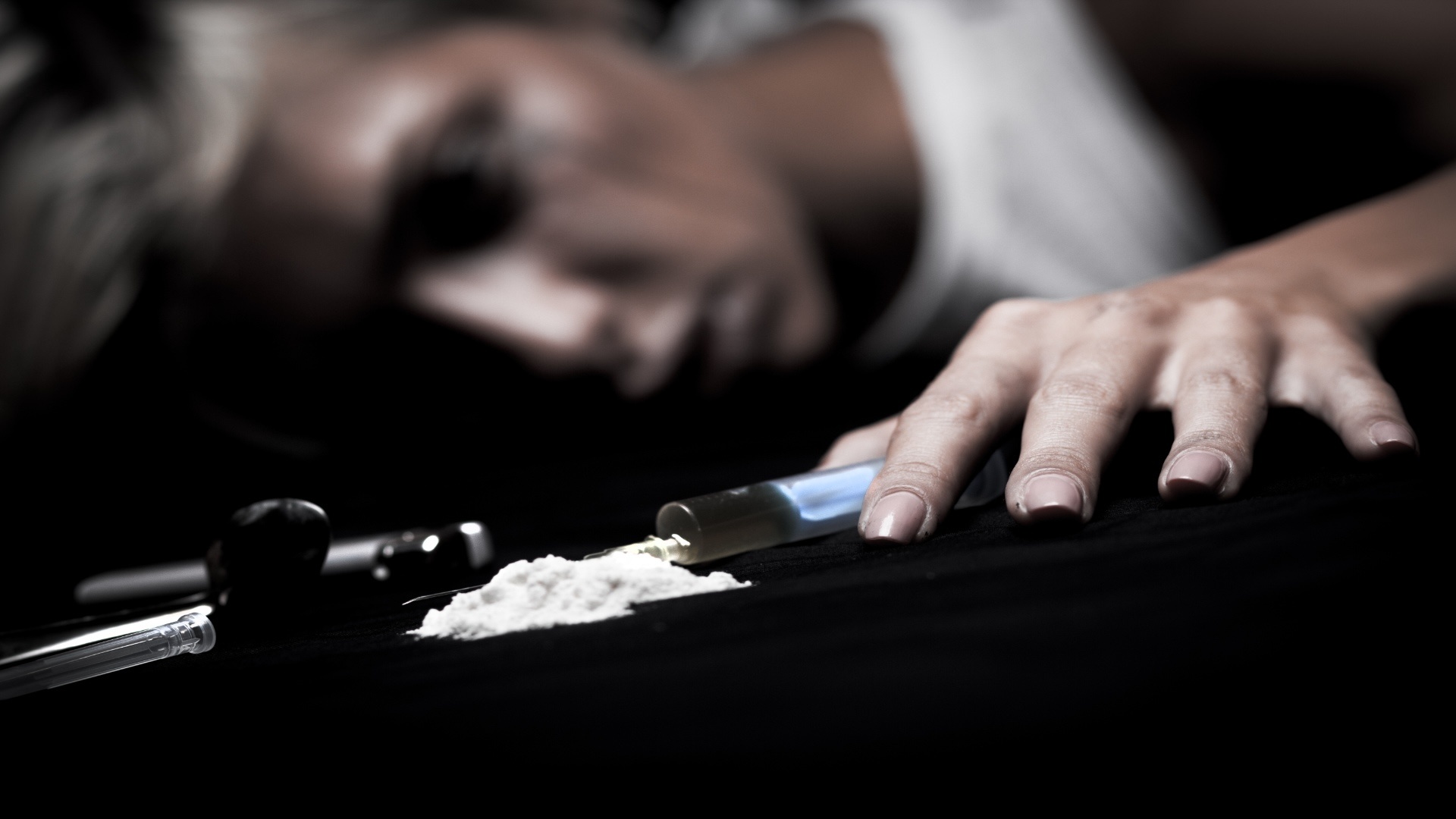 young-female-drug-addict-on-black-background-2023-11-27-05-14-53-utc (1)