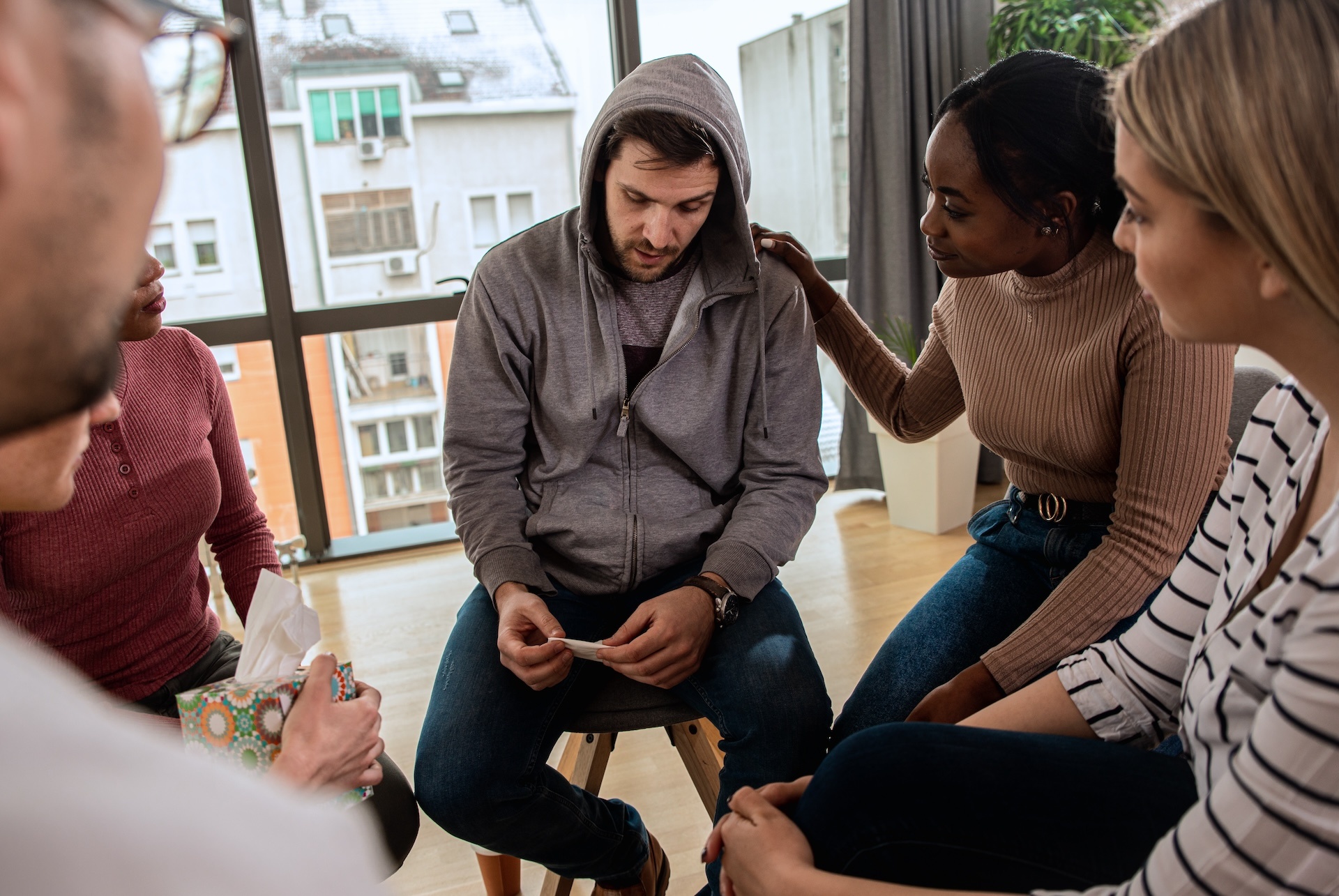 diverse-group-of-people-sitting-in-circle-in-group-2025-01-29-14-46-31-utc