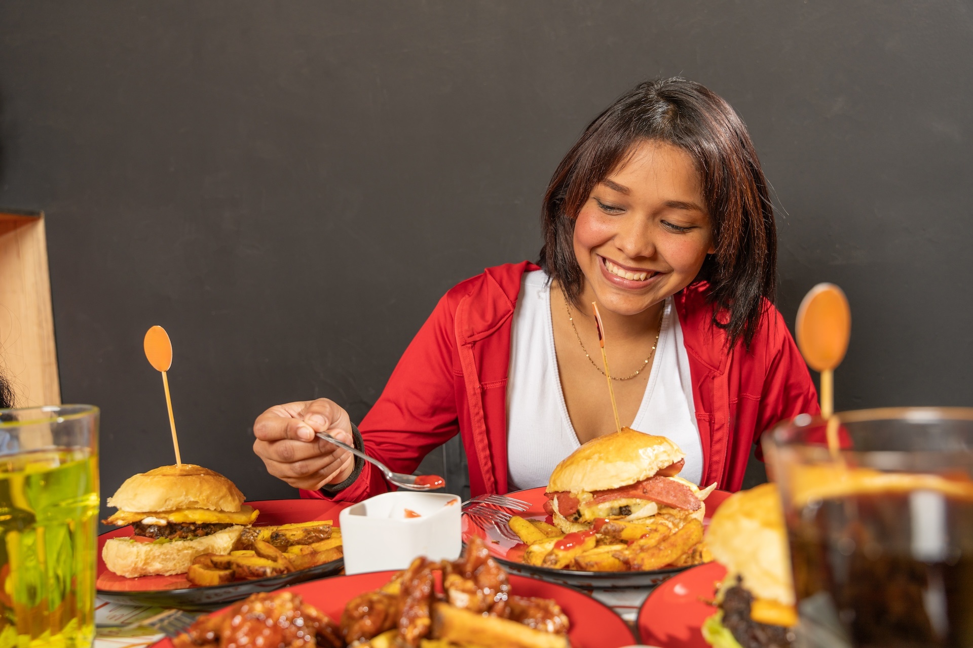 woman-enjoying-fast-food-meal-with-friends-2024-08-30-23-42-02-utc