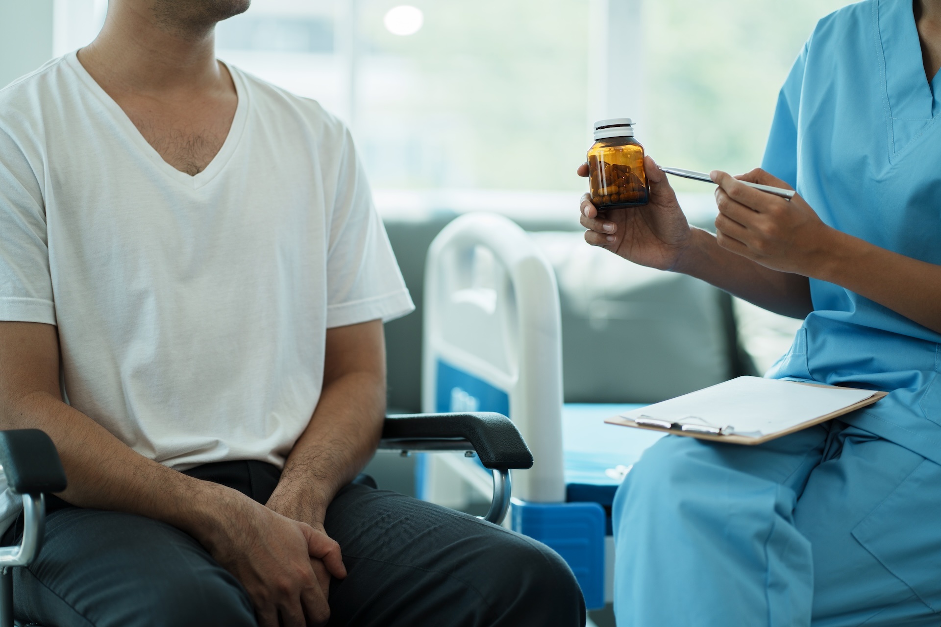 healthcare-worker-or-nurse-caregiver-giving-pills-2025-01-10-11-22-15-utc