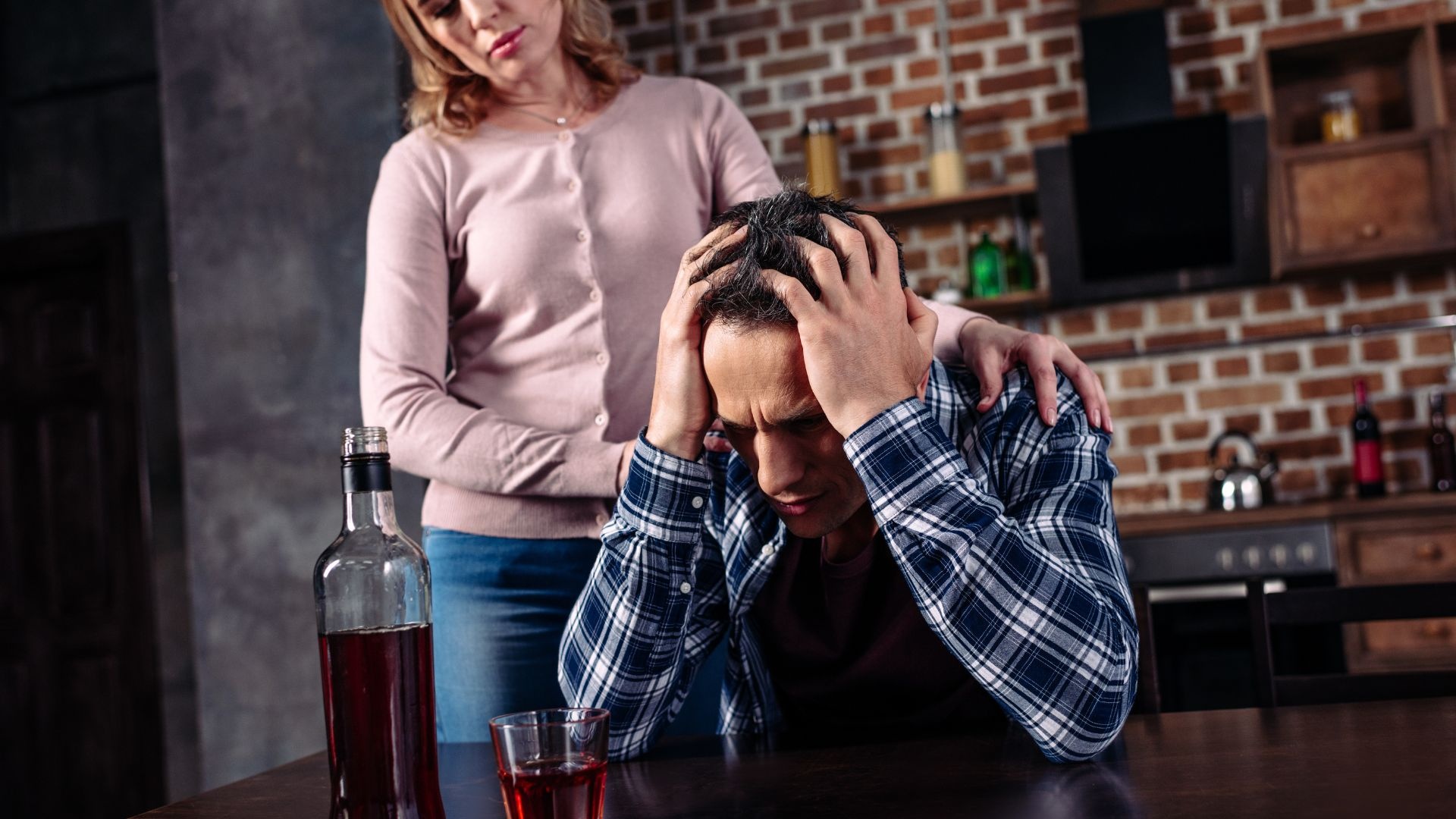 Alcoholic conditions: man at bar upset about condition caused by alcohol addiction. Alcoholic conditions: man at bar upset about condition caused by alcohol addiction.