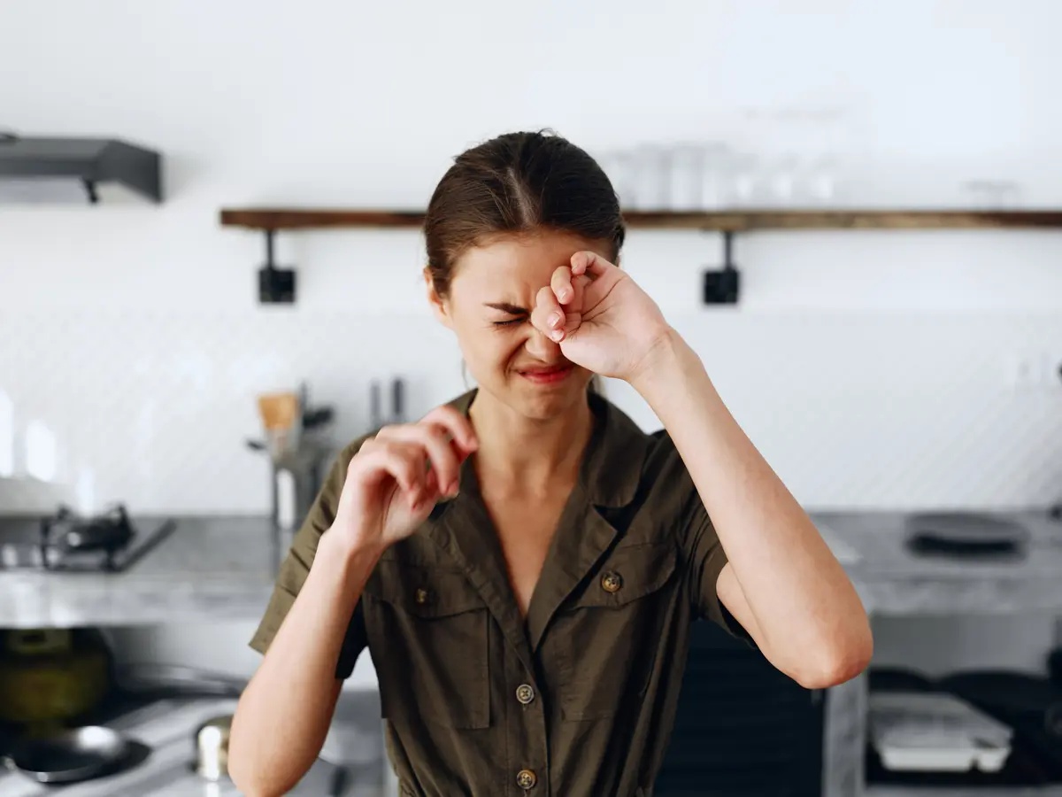 A woman struggling with symptoms of inhalant withdrawal.