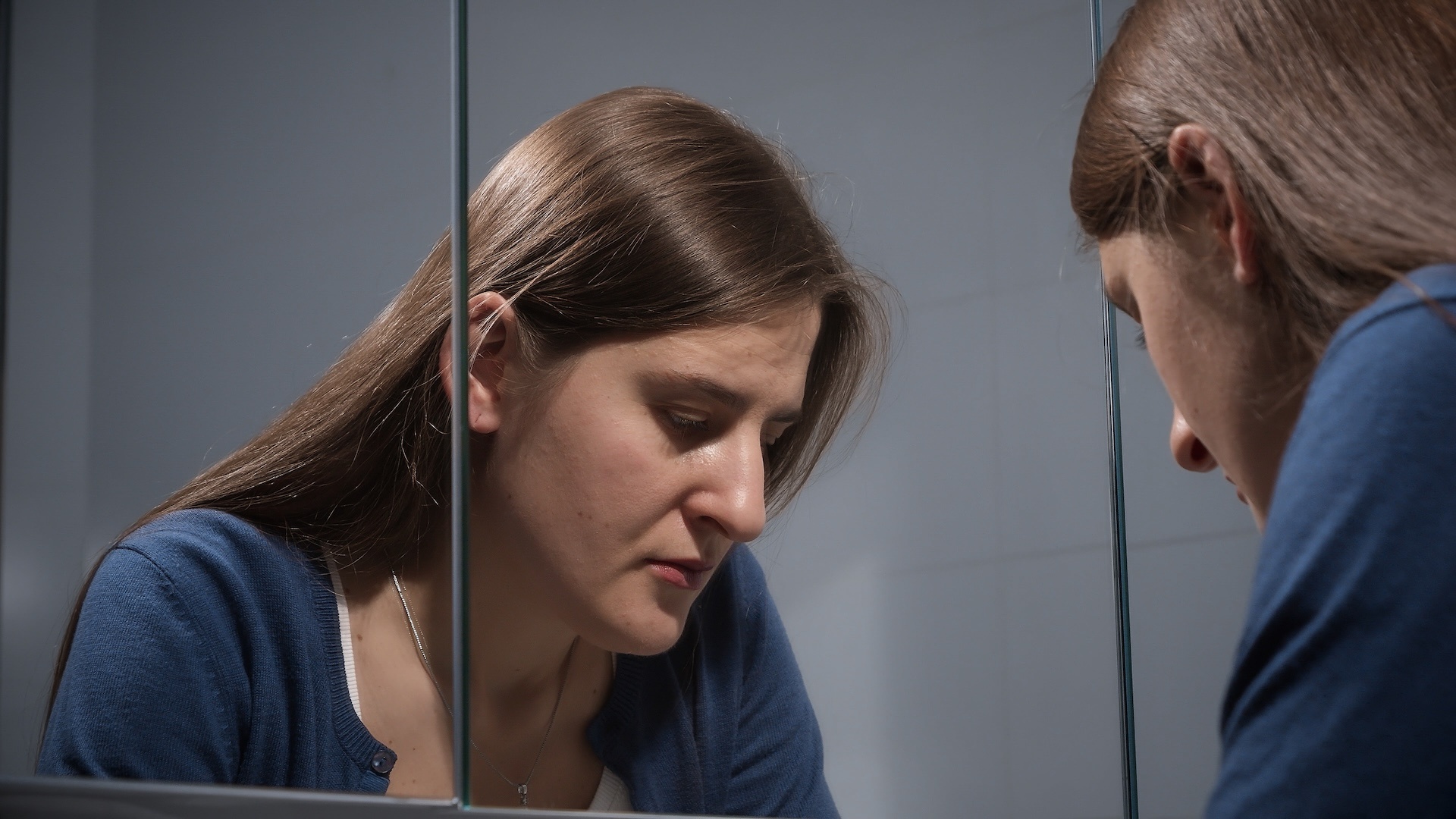 upset-stressed-woman-sighs-at-bathroom-and-looks-i-2025-01-08-07-22-18-utc