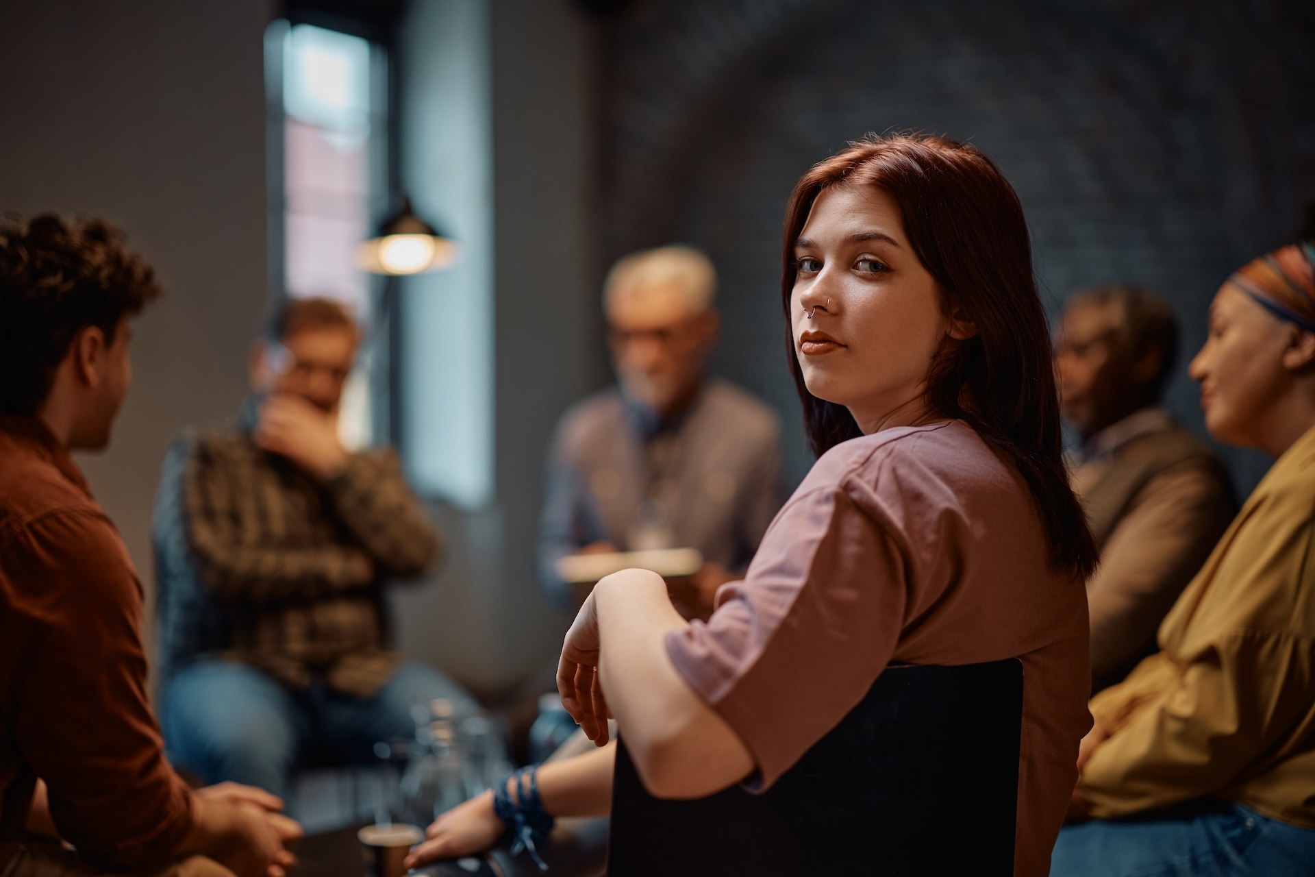 young-woman-attending-group-therapy-at-mental-heal-2025-02-23-16-51-34-utc