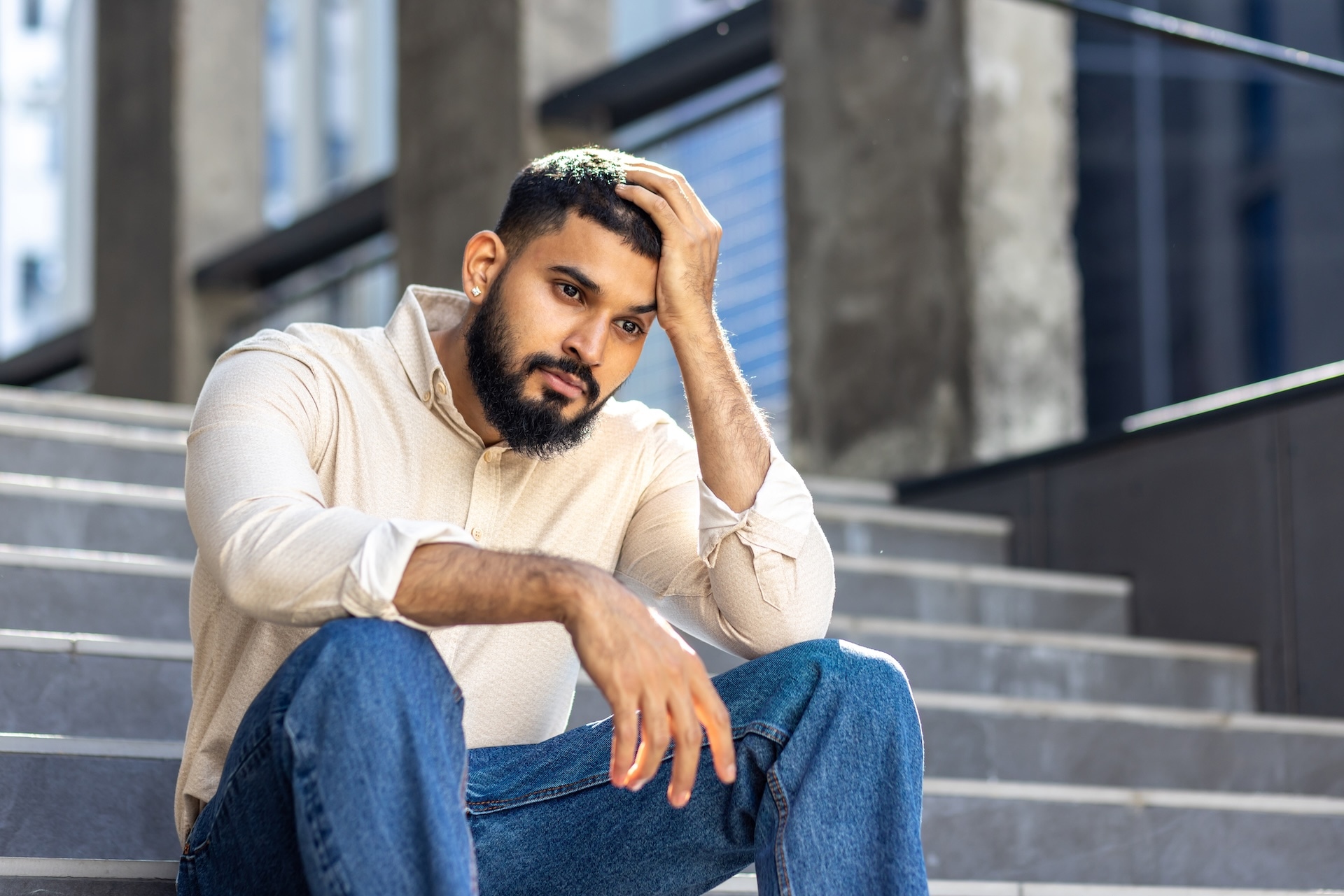 upset-and-disappointed-young-indian-man-sitting-on-2025-03-24-22-23-05-utc