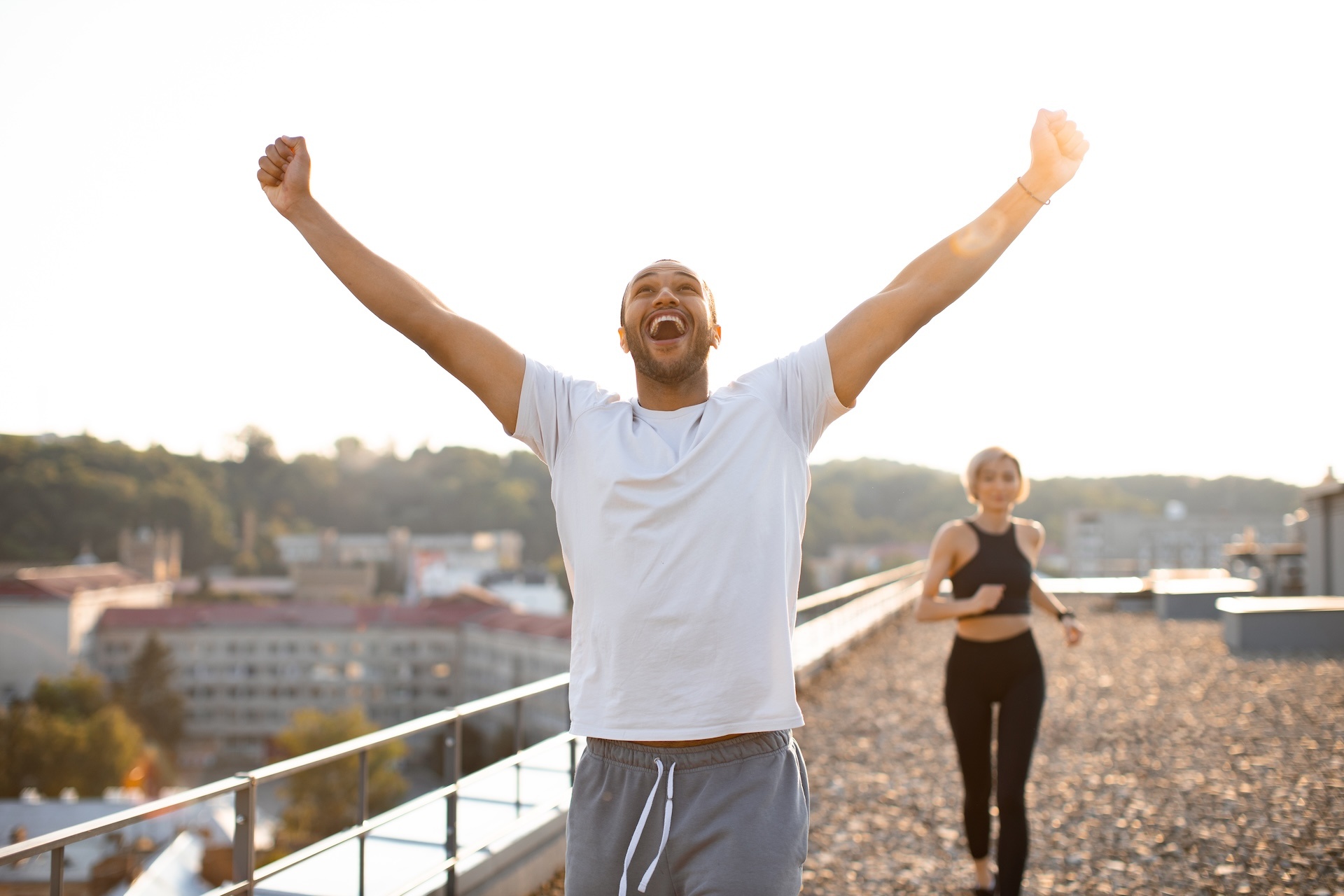 sporty-man-in-white-t-shirt-wins-running-competition
