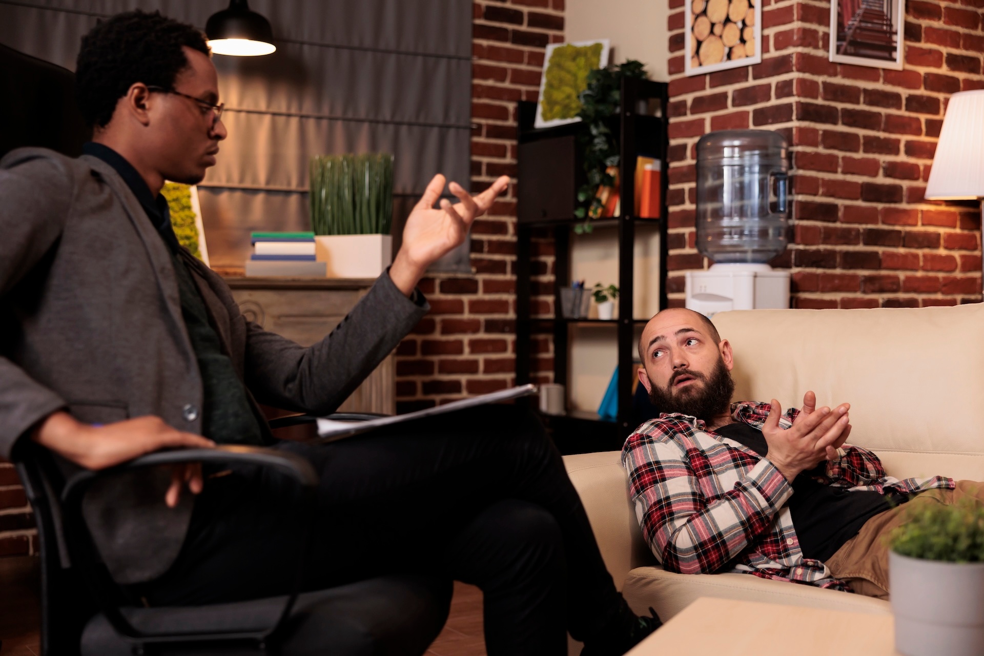 caucasian-man-talking-to-male-counselor-about-psyc-2025-02-19-19-48-49-utc