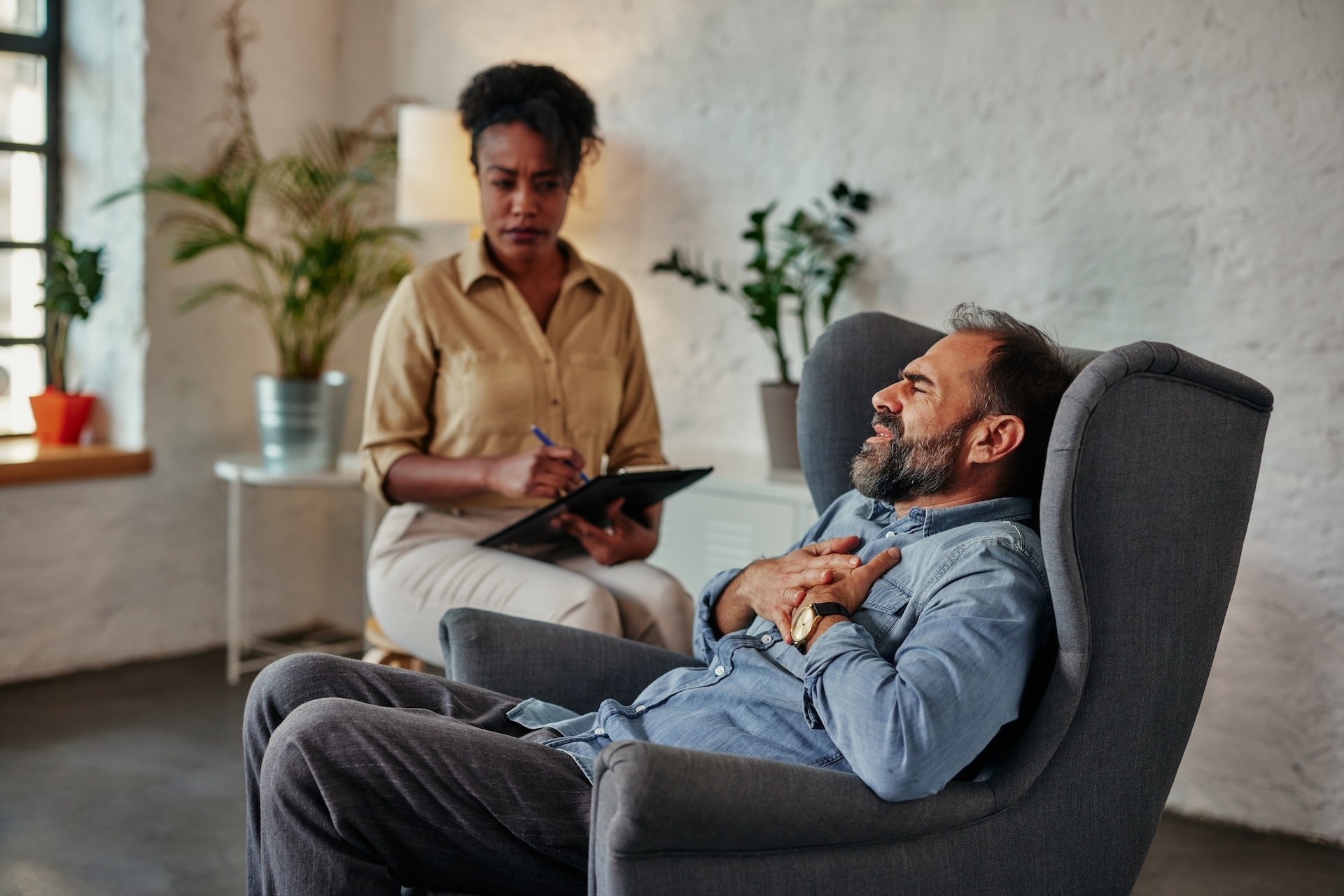 caring-counselor-listening-to-male-patient-2024-10-17-22-05-40-utc