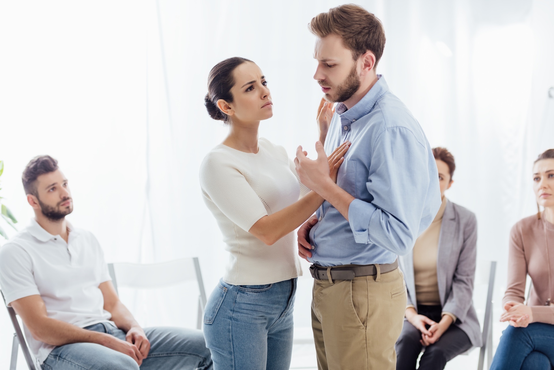 selective-focus-of-woman-consoling-man-during-grou-2024-11-07-16-37-20-utc