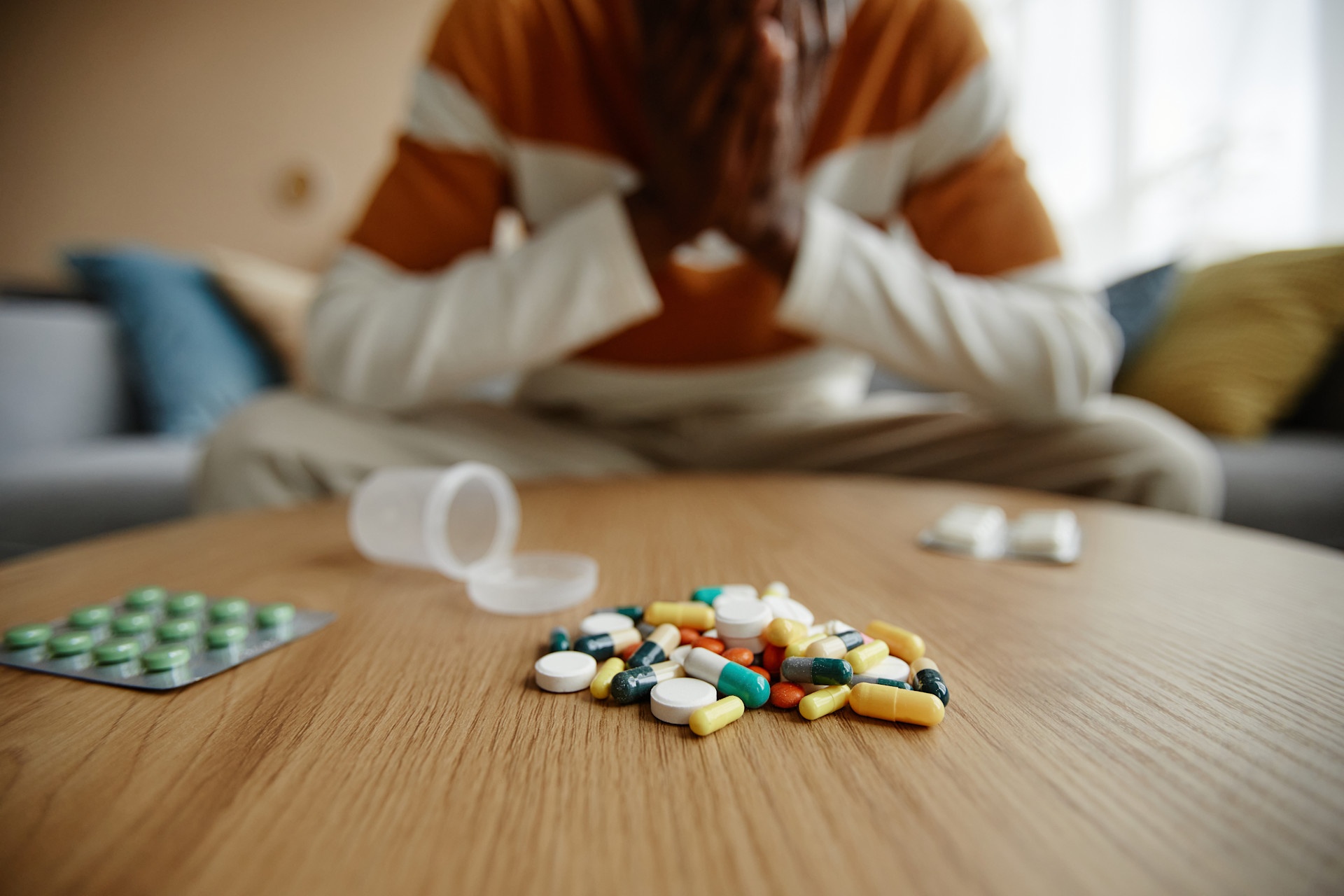 pile-of-pills-and-tablets-on-table-with-depressed-2023-11-27-04-53-01-utc