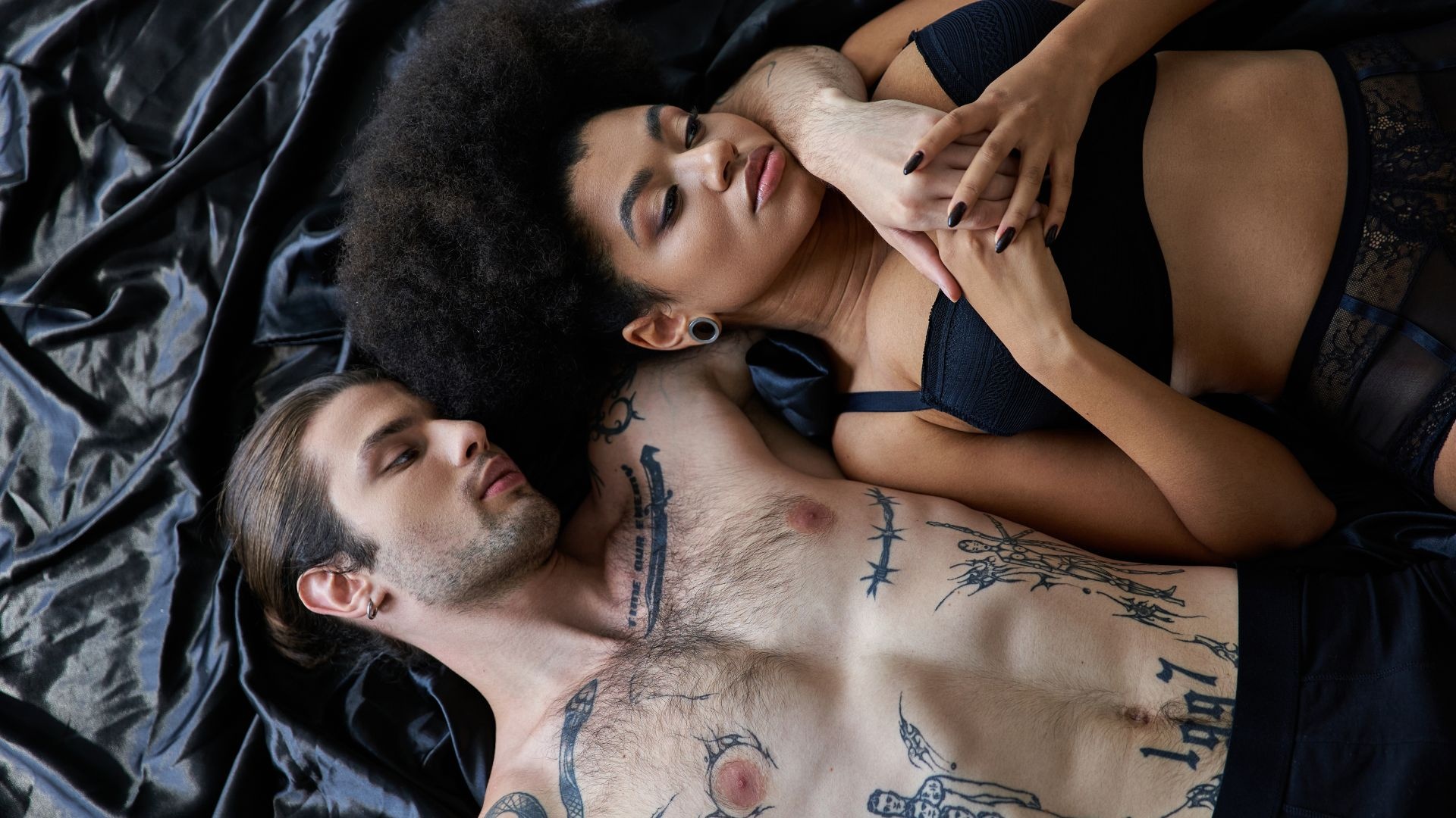 Sex addiction: man and woman laying next to each other Sex addiction: man and woman laying next to each other