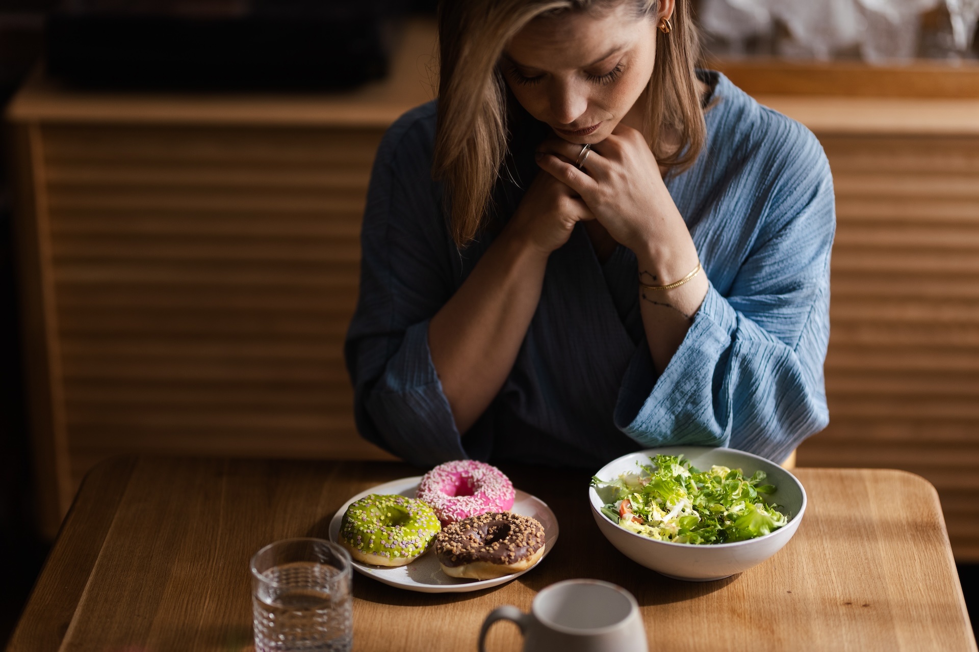 young-woman-having-diet-deciding-between-salad-an-2024-10-18-17-25-32-utc