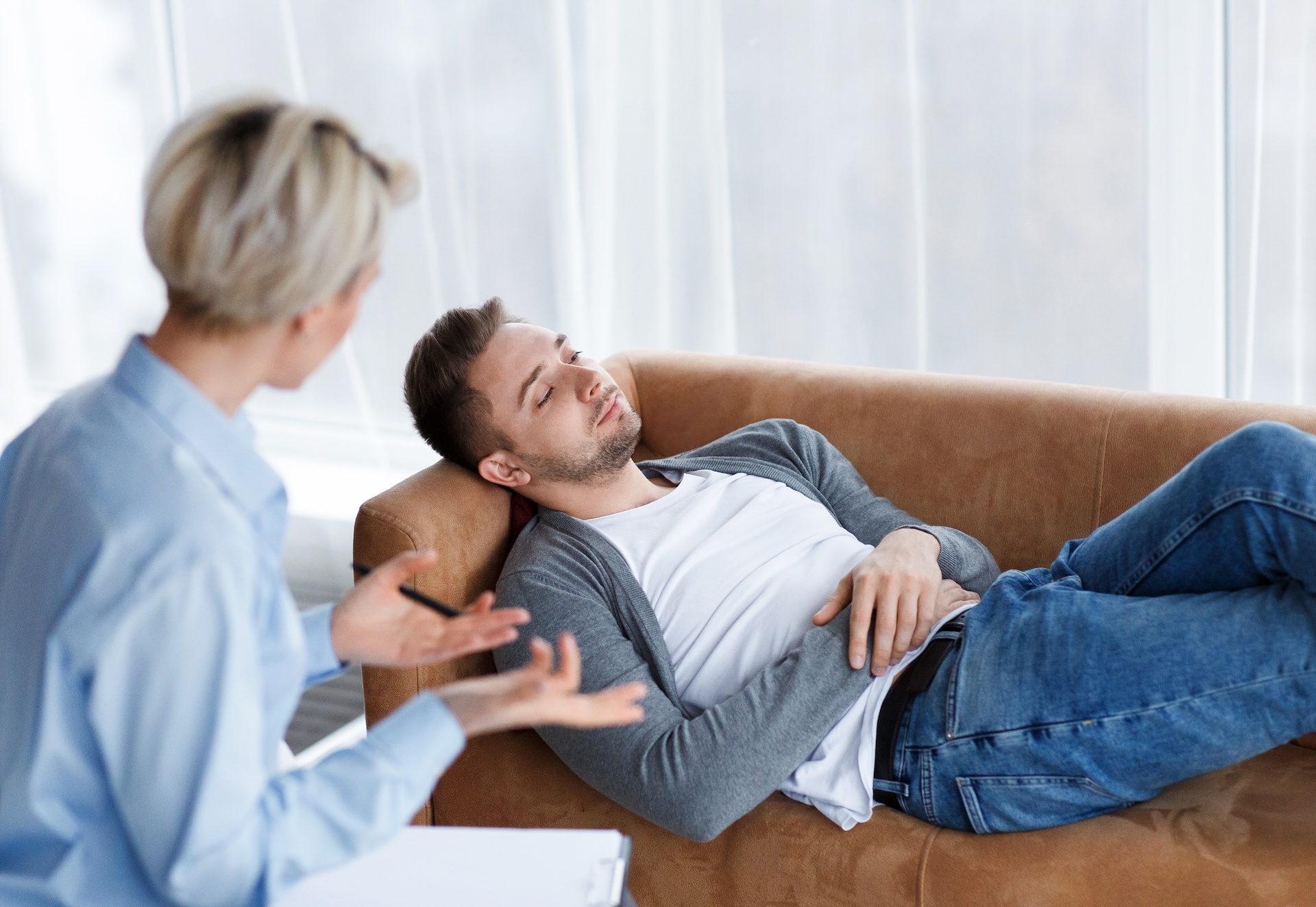 patient-talking-with-psychologist-lying-on-couch-i-2025-03-18-19-27-22-utc