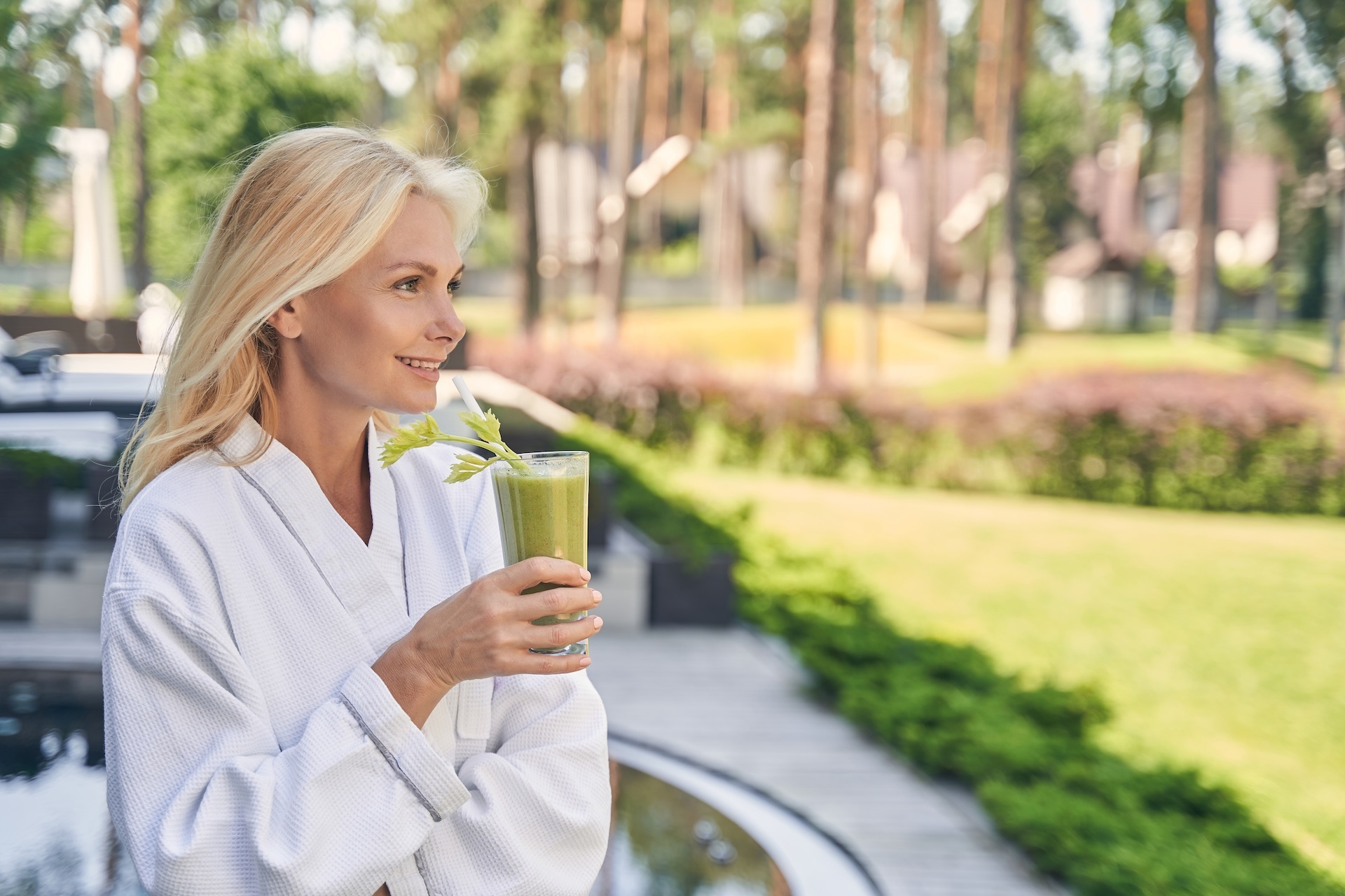 Luxury Detox: Female patient enjoying drink in serence environment. Luxury Detox: Female patient enjoying drink in serence environment.