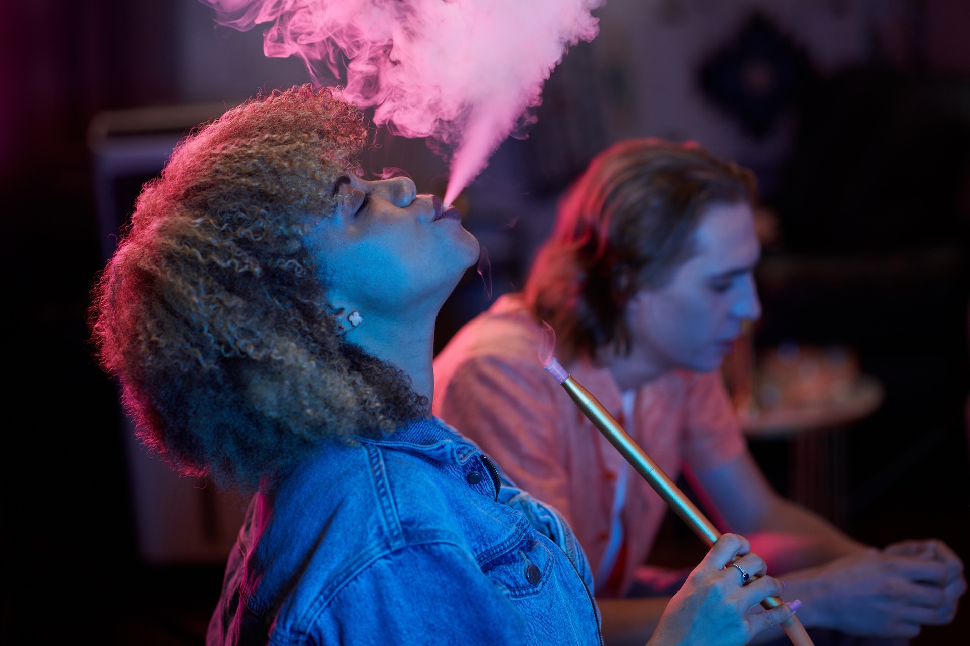 woman-exhaling-hookah-smoke-2023-11-27-04-50-29-utc