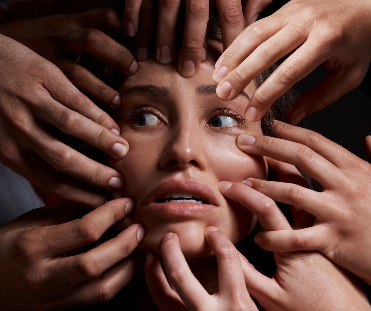 Cenesthopathic Schizophrenia causing strange sensations on a woman's face, with a lot of hands touching it. Cenesthopathic Schizophrenia causing strange sensations on a woman's face, with a lot of hands touching it.