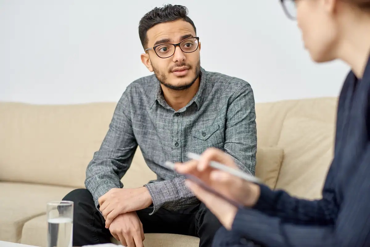A man in a DBT session with his therapist.