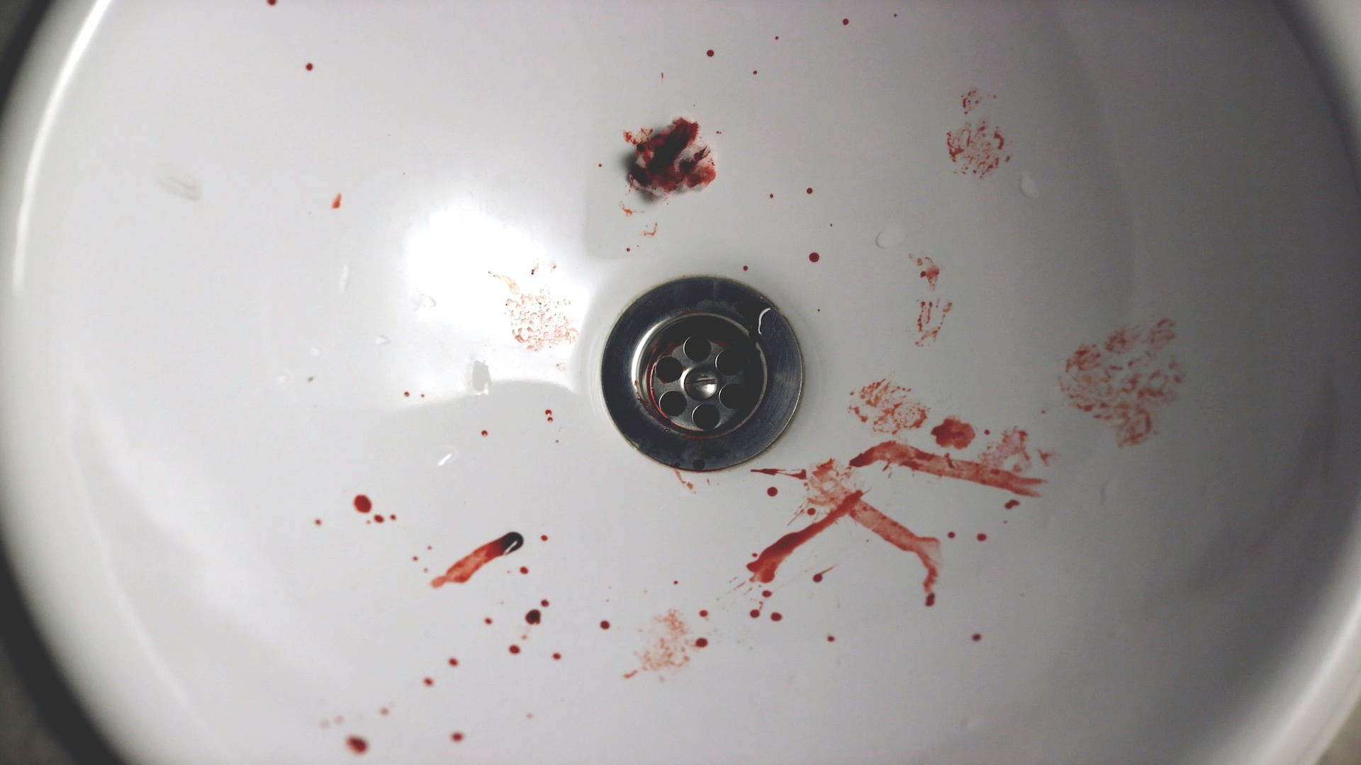close-up-of-sink-with-blood-drops-small-drops-of-blood-from-drinking-alcohol