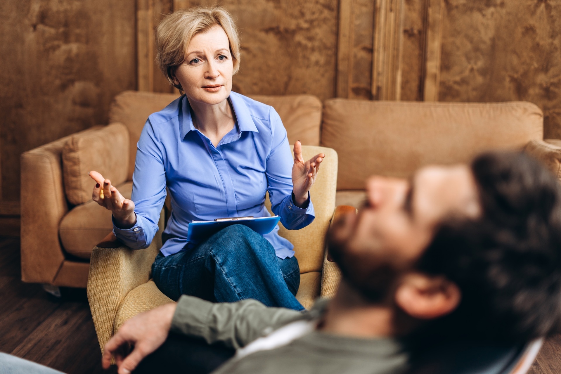 adult-female-psychiatrist-talking-to-young-bearded-2025-03-21-21-08-31-utc