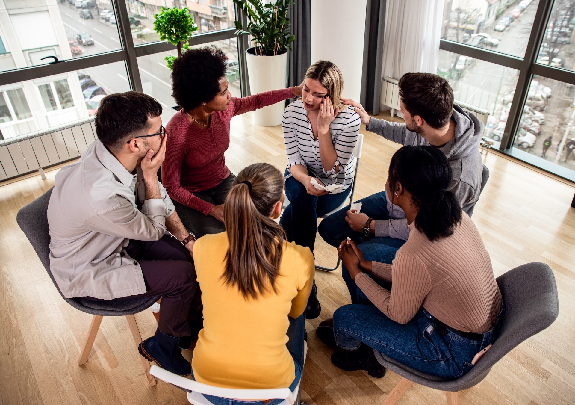 diverse-group-of-people-sitting-in-circle-in-group-2025-02-11-14-58-40-utc