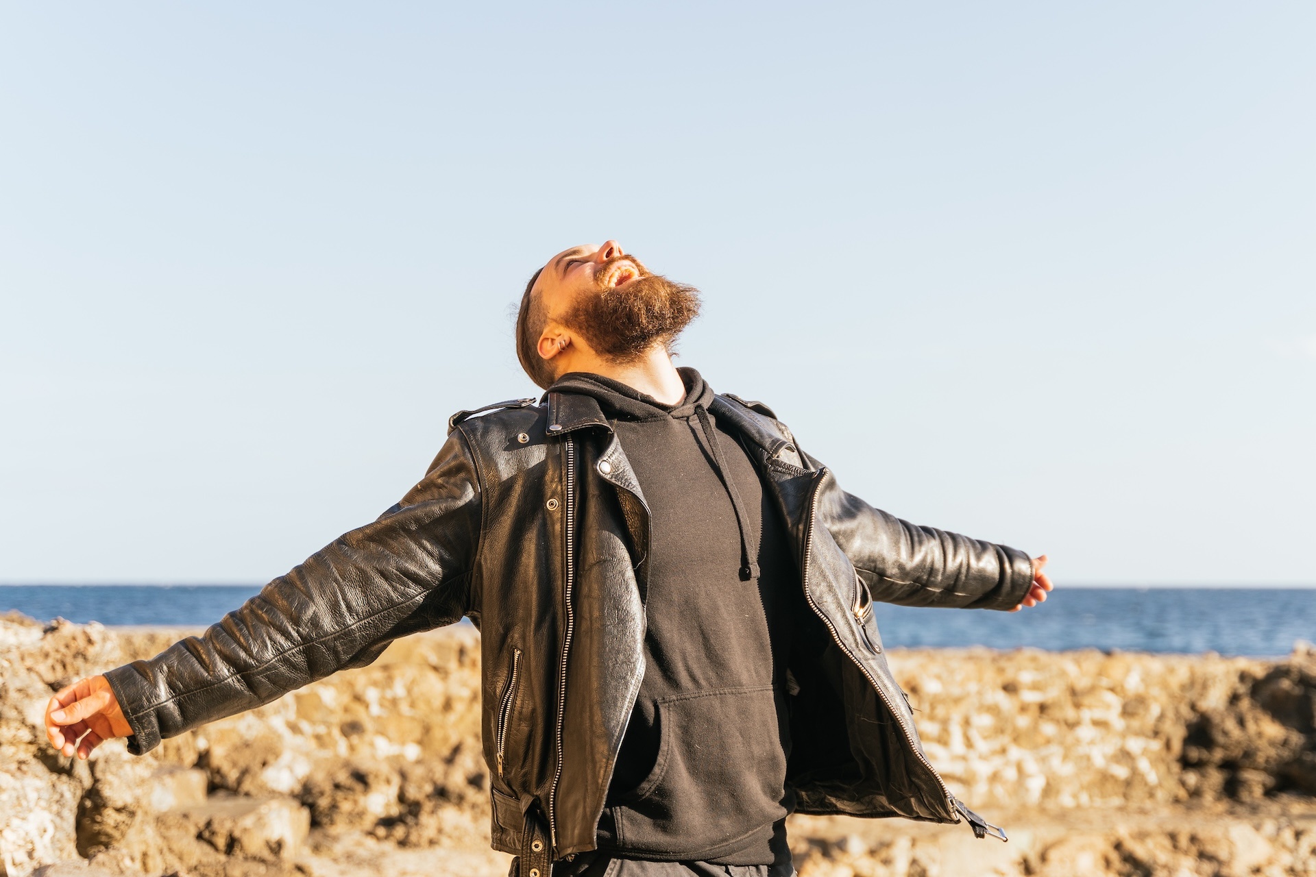 caucasian-man-with-long-hair-beard-and-sunglasses-2024-10-18-05-21-00-utc