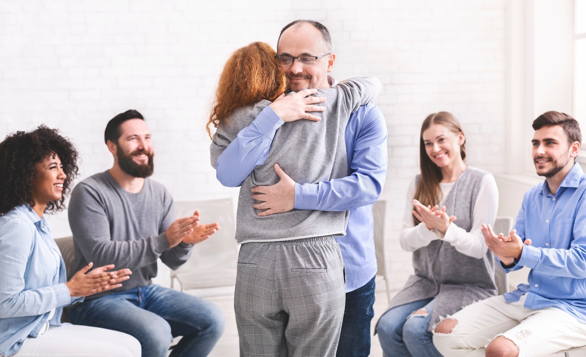 positive-people-hugging-during-group-rehab-therapy-2025-04-01-01-03-39-utc