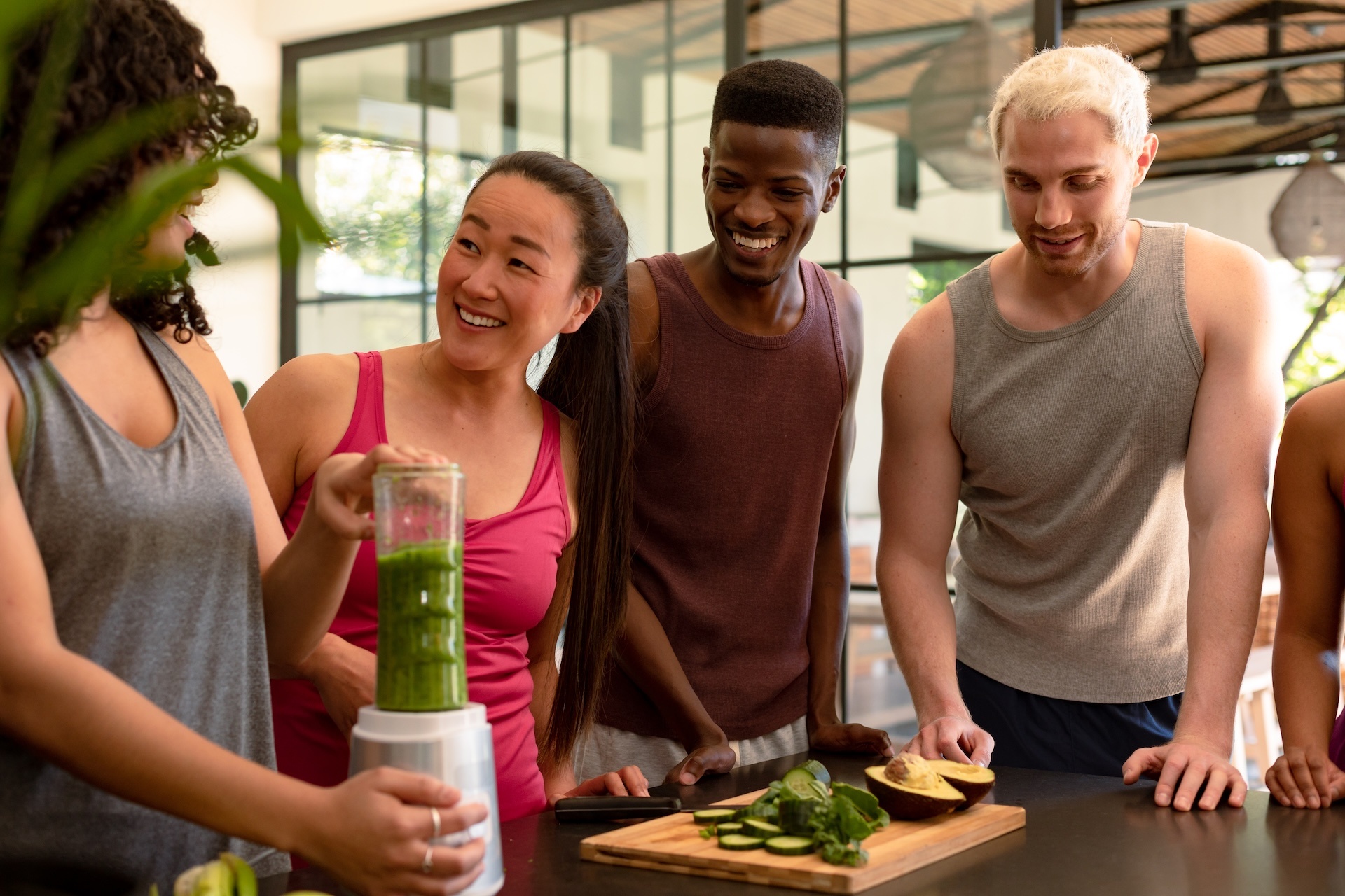 group-of-diverse-female-and-male-friends-preparing-healthy-drinks