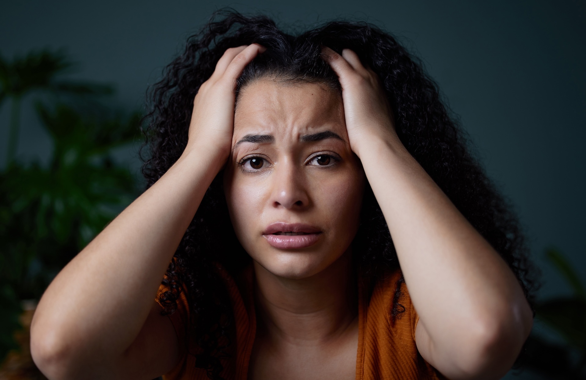 Distressed woman looking at camera for help