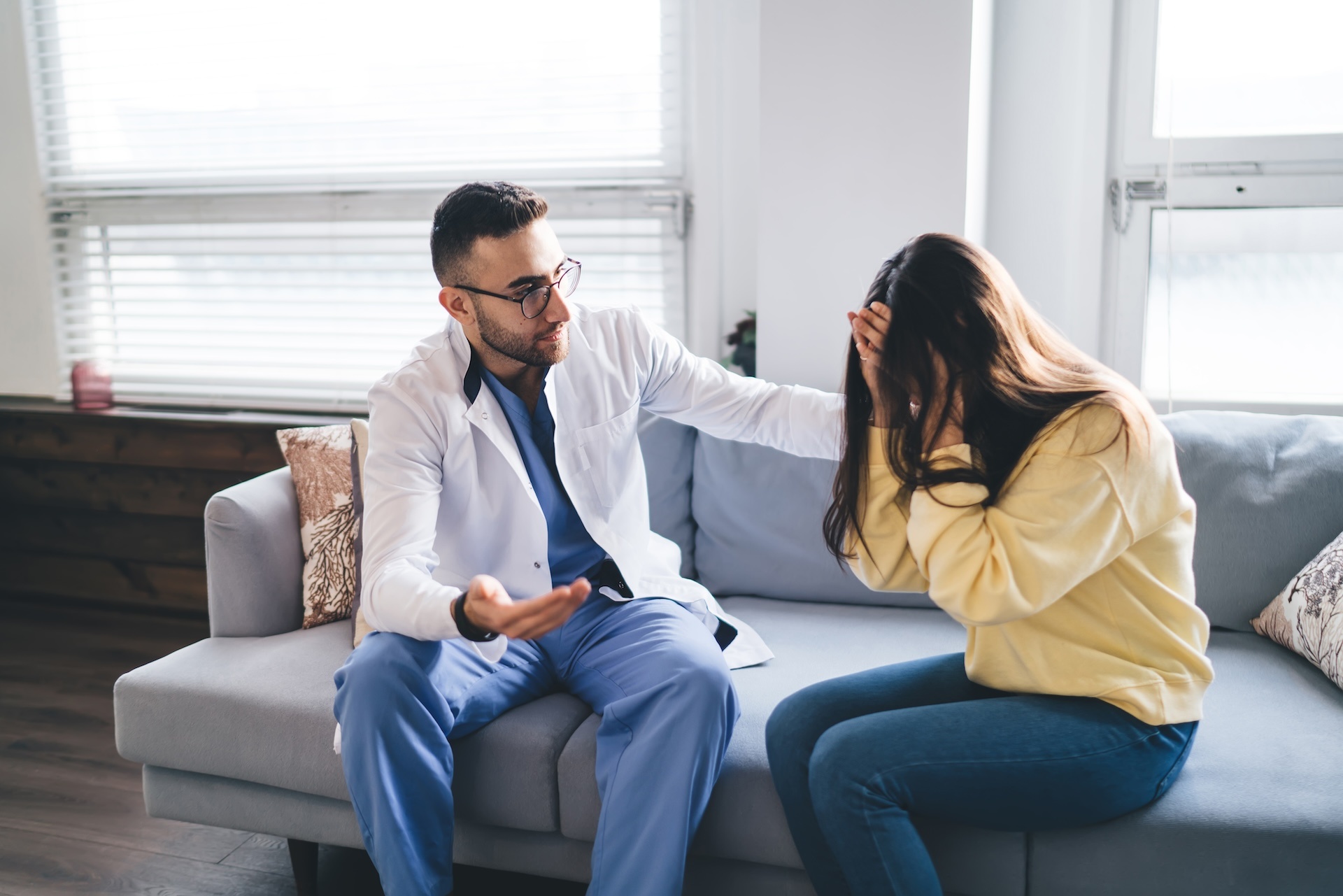 serious-male-psychotherapist-coming-down-crying-pa-2023-11-27-05-13-47-utc