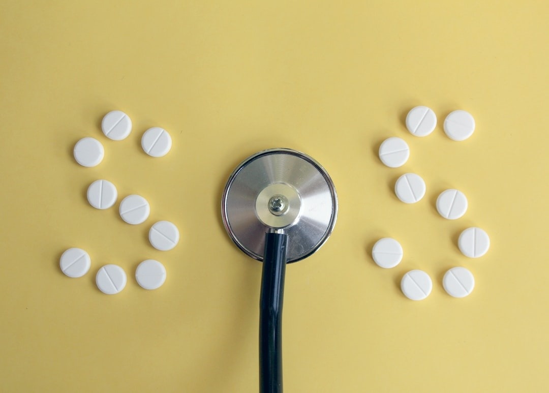Why Going Cold Turkey Is a Mistake Photo of a doctor's stethoscope and pills arranged to read "SOS."
