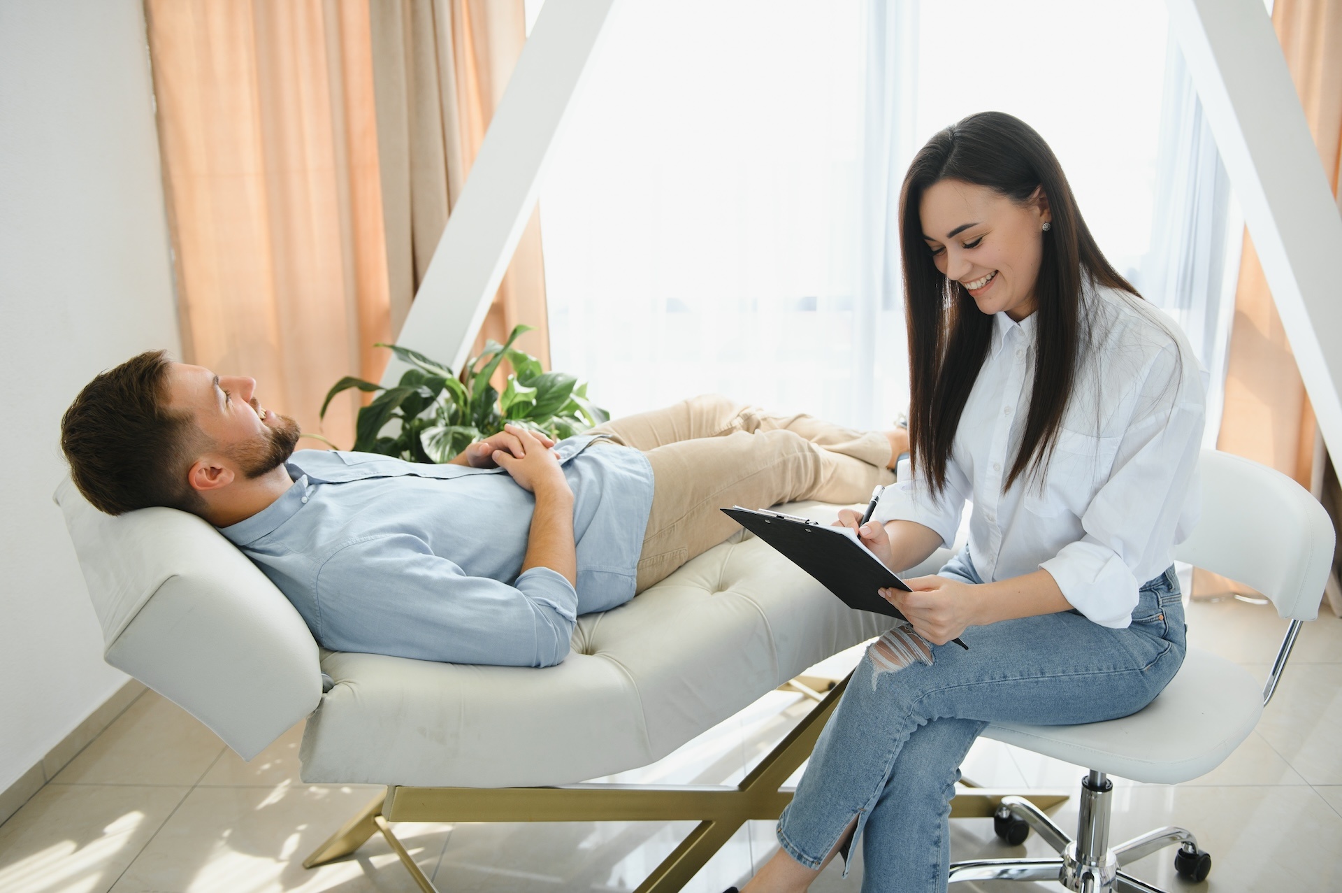 depressed-man-speaking-to-a-therapist-while-she-is-2024-02-12-18-31-05-utc