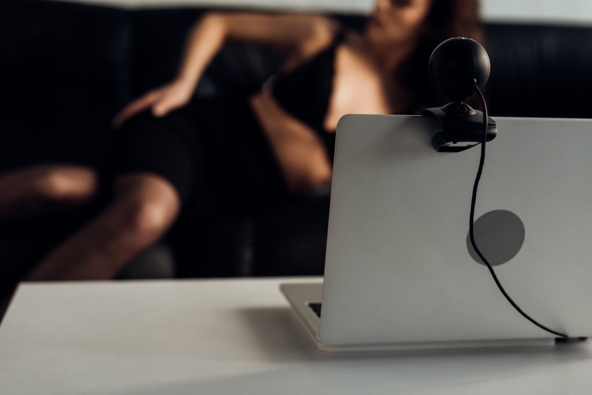 selective-focus-of-laptop-with-web-camera-and-sexy-2024-11-09-11-04-58-utc