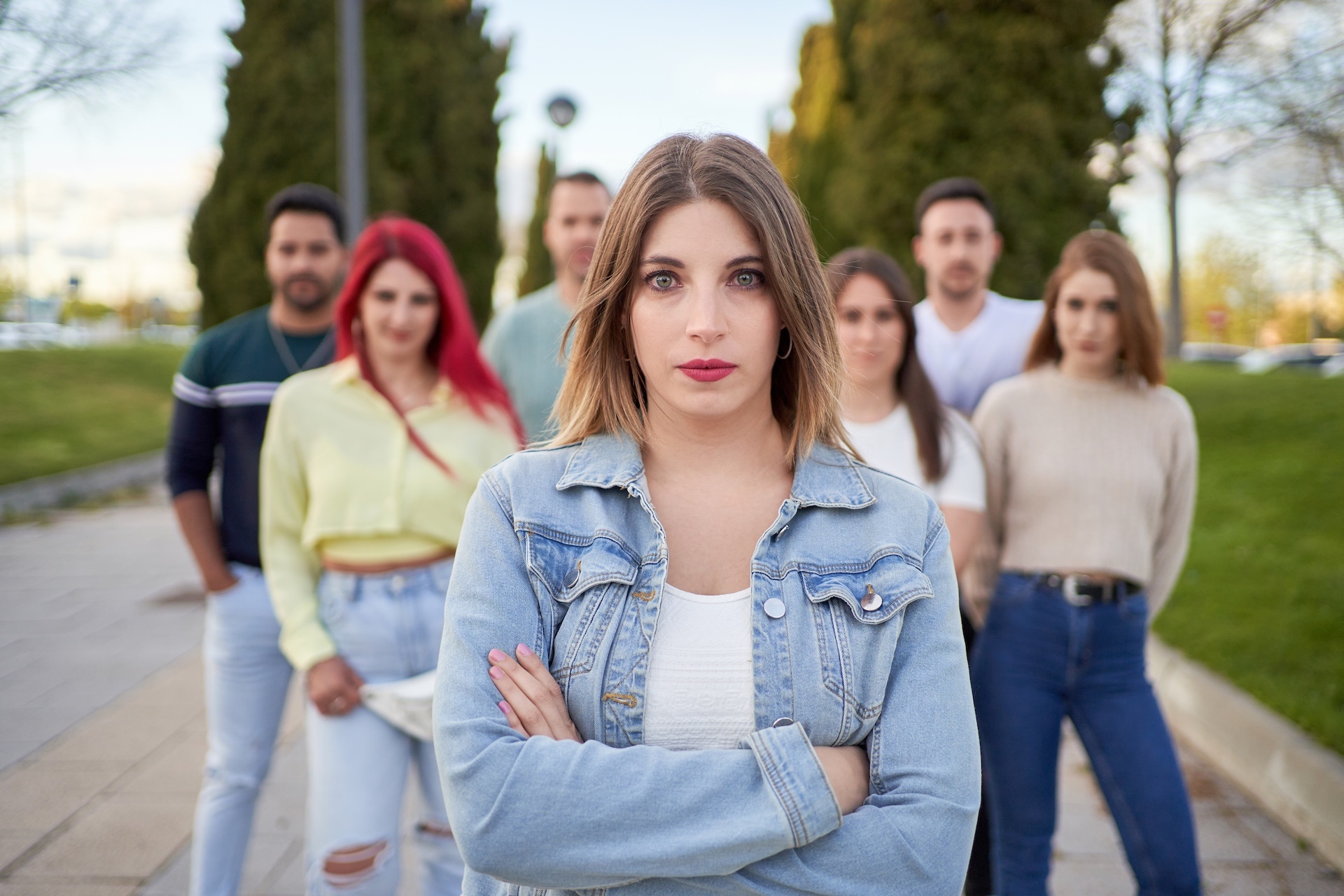group-of-serious-young-friends-standing-on-street-2024-12-04-14-45-20-utc